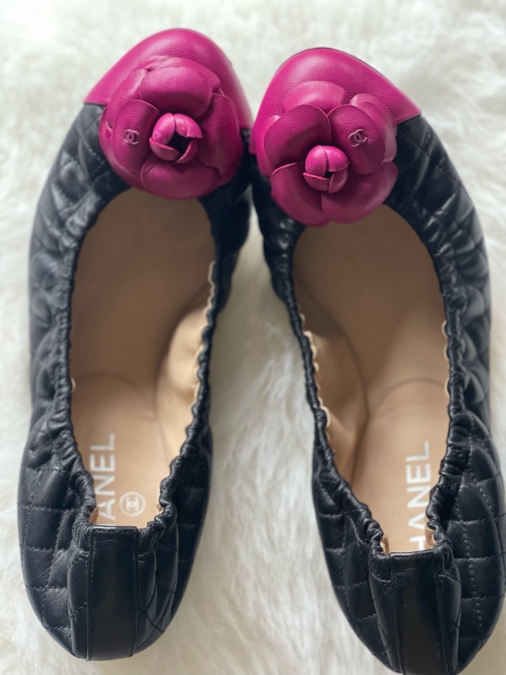 CHANEL Black authentic leather Flats with Hot Pink Camellia Appliqué